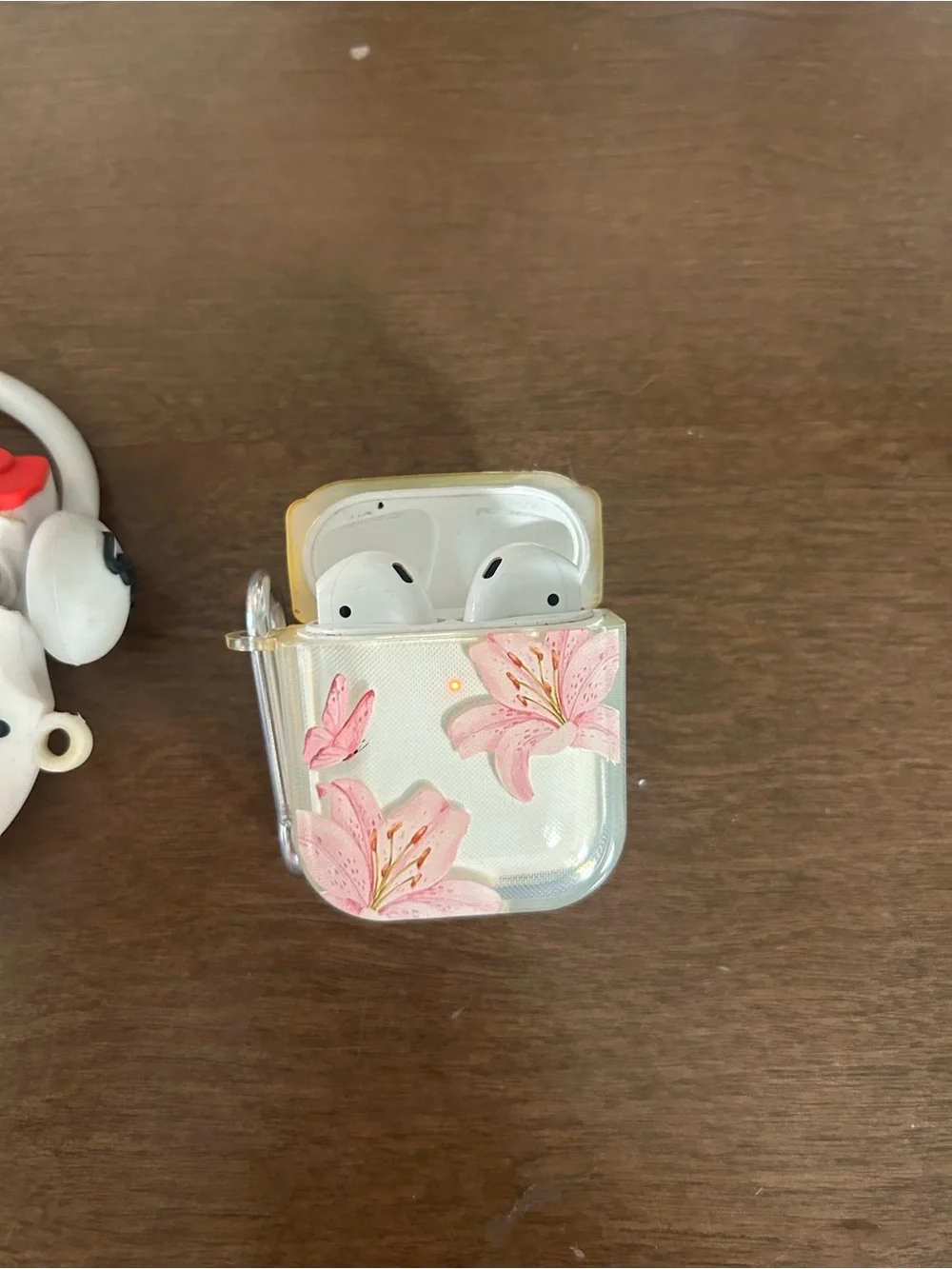 3 pairs of airpods with cases